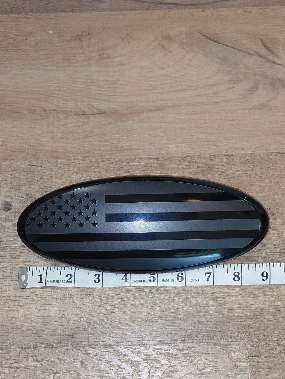 Blacked out American Flag Ford Oval Grille/Tailgate Emblem. New